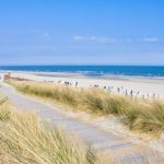 Strand von Norderney: Stadtwerke müssen saisonale Schwankungen in der Auslastung des Netzes abfangen.